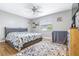 Spacious bedroom with a floral comforter and a ceiling fan at 3411 28Th E St, Bradenton, FL 34208