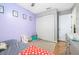 bedroom with lavender walls and plenty of storage at 3411 28Th E St, Bradenton, FL 34208