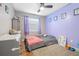 Cozy bedroom with lavender walls and twin-size bed at 3411 28Th E St, Bradenton, FL 34208