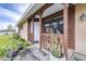 Front entrance with wooden posts and potted plants at 3411 28Th E St, Bradenton, FL 34208