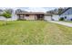 House with a neatly landscaped lawn and driveway at 3411 28Th E St, Bradenton, FL 34208