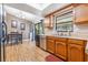 Kitchen with wood cabinets, stainless steel appliances, and wood floors at 3411 28Th E St, Bradenton, FL 34208