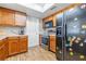 Kitchen with wood cabinets, stainless steel appliances, and wood floors at 3411 28Th E St, Bradenton, FL 34208