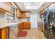 Bright kitchen with wood cabinets and stainless steel appliances at 3411 28Th E St, Bradenton, FL 34208