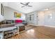 Living room with sectional sofa, wood floors, and TV at 3411 28Th E St, Bradenton, FL 34208