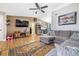 Open concept living area with sectional sofa and wood floors at 3411 28Th E St, Bradenton, FL 34208