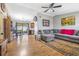 Open living area with L-shaped sofa and wood flooring at 3411 28Th E St, Bradenton, FL 34208