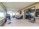 Relaxing screened patio with seating and grill at 3411 28Th E St, Bradenton, FL 34208