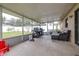 Relaxing screened patio with seating and grill at 3411 28Th E St, Bradenton, FL 34208