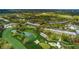 Aerial view of golf course community with buildings at 36750 Us Highway 19 # 21-301, Palm Harbor, FL 34684