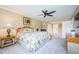 Primary bedroom with king bed and large TV at 36750 Us Highway 19 # 21-301, Palm Harbor, FL 34684