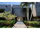 Main entrance of the building with a walkway at 36750 Us Highway 19 # 21-301, Palm Harbor, FL 34684
