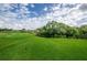 Expansive green golf course with lush landscaping at 36750 Us Highway 19 # 21-301, Palm Harbor, FL 34684