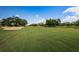 Golf course fairway with sand trap at 36750 Us Highway 19 # 21-301, Palm Harbor, FL 34684