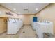 Convenient shared laundry room with multiple washer/dryers at 36750 Us Highway 19 # 21-301, Palm Harbor, FL 34684