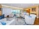Spacious living room with neutral colored furniture and hardwood floors at 36750 Us Highway 19 # 21-301, Palm Harbor, FL 34684