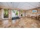 Lobby with tile flooring, brick walls, and access to the outdoors at 36750 Us Highway 19 # 21-301, Palm Harbor, FL 34684