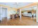 Home office with wood floors and view of living room at 36750 Us Highway 19 # 21-301, Palm Harbor, FL 34684