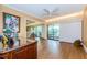 Home office with wood floors and sliding doors to balcony at 36750 Us Highway 19 # 21-301, Palm Harbor, FL 34684