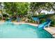 Refreshing pool with two blue water slides at 36750 Us Highway 19 # 21-301, Palm Harbor, FL 34684