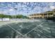 Community tennis courts with surrounding landscaping at 36750 Us Highway 19 # 21-301, Palm Harbor, FL 34684