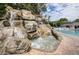 Stunning waterfall feature with a small pool at 36750 Us Highway 19 # 21-301, Palm Harbor, FL 34684