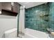 Bathroom with teal tile and built-in shelving at 3817 W Platt St # 306, Tampa, FL 33609