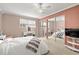 Bedroom with mirrored closet doors and ceiling fan at 3817 W Platt St # 306, Tampa, FL 33609
