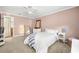 Bedroom with mirrored closet doors and ceiling fan at 3817 W Platt St # 306, Tampa, FL 33609