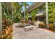 Courtyard with fountain, lush landscaping, and a bench at 3817 W Platt St # 306, Tampa, FL 33609