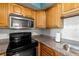 Kitchen with stainless steel appliances and granite countertops at 3817 W Platt St # 306, Tampa, FL 33609