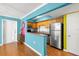 Bright kitchen with stainless steel appliances and wood cabinets at 3817 W Platt St # 306, Tampa, FL 33609