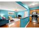Open living room and kitchen with hardwood floors at 3817 W Platt St # 306, Tampa, FL 33609
