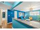 View of living room from kitchen with granite counter at 3817 W Platt St # 306, Tampa, FL 33609