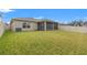 Spacious backyard with screened patio and fence at 3946 Postmark Lake Pl, Seffner, FL 33584