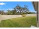 Landscaped backyard with vinyl fence at 3946 Postmark Lake Pl, Seffner, FL 33584