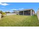 Large backyard with screened porch and fence at 3946 Postmark Lake Pl, Seffner, FL 33584