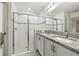 Bathroom with double vanity, granite countertop, and shower at 3946 Postmark Lake Pl, Seffner, FL 33584