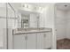 Bathroom with granite countertop, double sinks, and shower at 3946 Postmark Lake Pl, Seffner, FL 33584