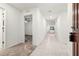 Bright entry hall with tile flooring and carpet, leading to other rooms at 3946 Postmark Lake Pl, Seffner, FL 33584