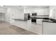 Modern kitchen with island and stainless steel appliances at 3946 Postmark Lake Pl, Seffner, FL 33584