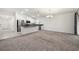 Modern kitchen featuring stainless steel appliances and an island at 3946 Postmark Lake Pl, Seffner, FL 33584