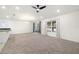 Spacious living room with carpeted floors and ceiling fan at 3946 Postmark Lake Pl, Seffner, FL 33584