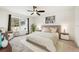 Main bedroom with large bed and window, carpeted at 3946 Postmark Lake Pl, Seffner, FL 33584