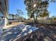 Large backyard with a patio and a wooden fence at 4039 Eastridge Dr, Valrico, FL 33596