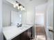 Modern bathroom with dark vanity, white countertop and updated lighting at 4039 Eastridge Dr, Valrico, FL 33596