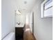 Clean bathroom with dark vanity and wood-look floors at 4039 Eastridge Dr, Valrico, FL 33596