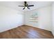 Spacious bedroom with wood-look floors and ceiling fan at 4039 Eastridge Dr, Valrico, FL 33596