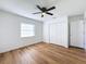 Spacious bedroom with wood-look floors and ceiling fan at 4039 Eastridge Dr, Valrico, FL 33596