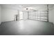 Spacious garage with ample storage space and overhead door at 4039 Eastridge Dr, Valrico, FL 33596